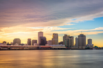 New Orleans, Louisiana, USA skyline on the Mississippi River at dusk.