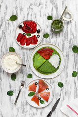 spinach pancakes with salmon, grilled bell pepper, cream cheese, pesto, mascarpone