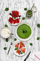 spinach pancakes with salmon, grilled bell pepper, cream cheese, pesto, mascarpone
