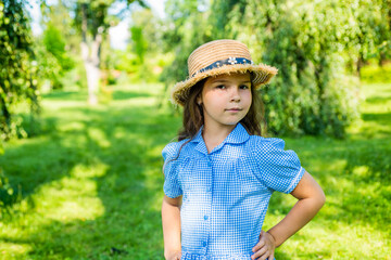 Cute girl straw hat rustic style nature background, family values