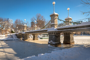 A bridge over the frozen lake in the Boston Public Garden