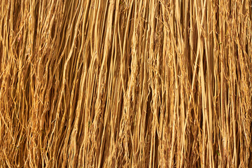A Straw Broom. Straw texture close-up. Flax straw