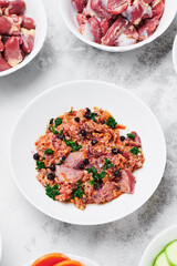 organic dog food. cold cuts with herbs and berries. close-up