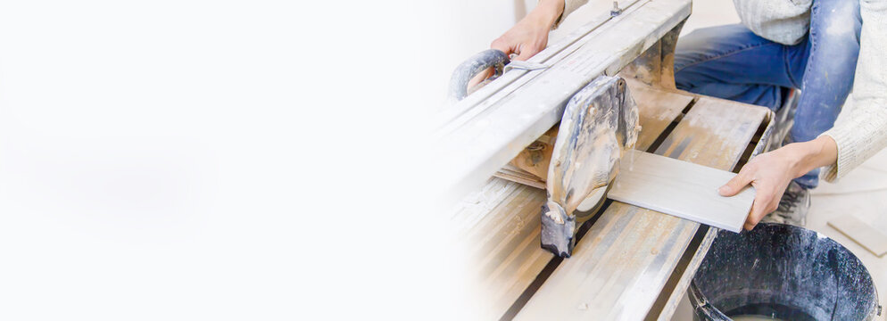 cut tiles with a tile cutter repair in the house. Selective focus.