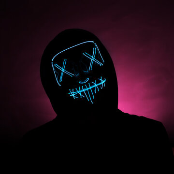 Incognito In A Glowing Blue Mask On A Highlighted Red Background