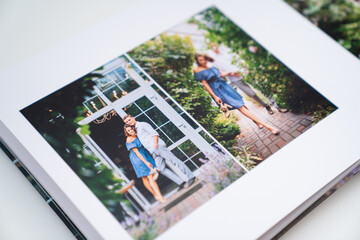 pages of photobook from photo shoots of a beautiful happy couple in the garden