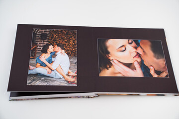 Fototapeta na wymiar pages of photobook from photo shoots of a beautiful happy couple in retro house.