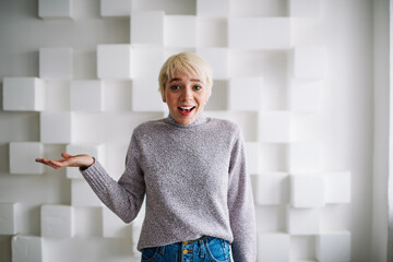 Happy woman in casual clothes gesticulating
