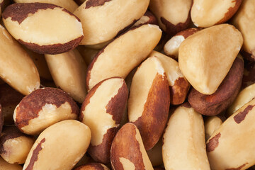 Brazil nuts closeup background, top view  