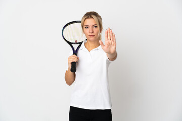 Young Russian woman tennis player isolated on white background making stop gesture