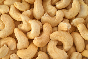Cashew nuts closeup background, top view               