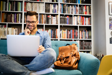 Student preparing exam and learning lessons in school library