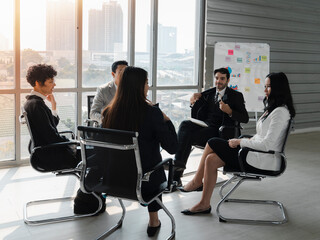 happy business people sitting in a circle meeting participating consult with diverse people and brainstroming business plan analysis