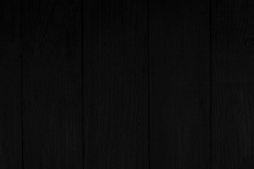 Obraz premium Wooden background of black from the old boards located apeak.