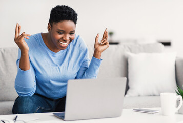 Black woman having video call using laptop and talking