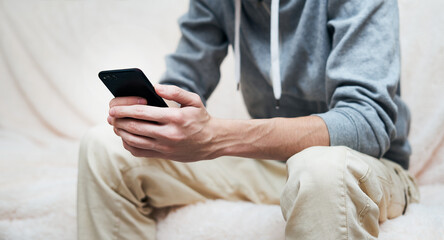 smartphone in hands of man, communication with friends