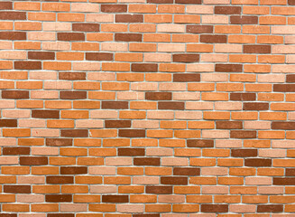 Raw brick wall background in red and brown color.