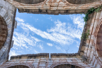 Blue sky as seen from an old stone building: Simulation of a painting where the canvas is the blue sky and the walls of an old stone building are the frame.