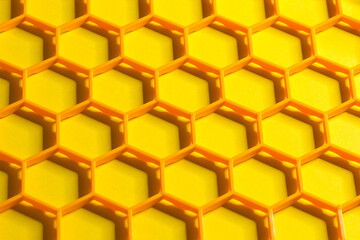 Hexagonal cells grid on a yellow background. Abstract geometric texture. Honeycomb concept