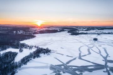 Fototapeta na wymiar Drone shot above the Dam reservoir in Bautzen during sunset with frozen lake winter season ice snow