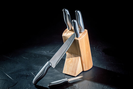 Set of kitchen knifes on dark background with copy space