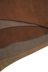 Obraz na płótnie Canvas Brown real leather mixed set isolated on white background.Natural leather texture close-up.Material for shoes, clothing and leather accessories. Leather surface.Hobby and craft.copy space. 