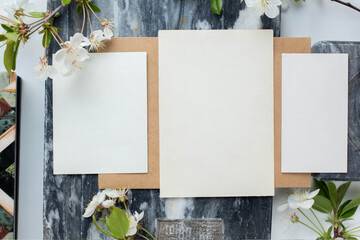 cards branding mockup template on dark marble background, with flowers. place for your design....