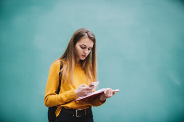 Young woman browsing smartphone during break