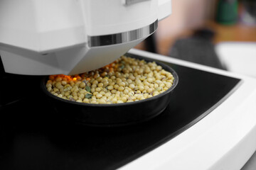 Multipurpose infrared analyzer for grain samples in modern laboratory, closeup