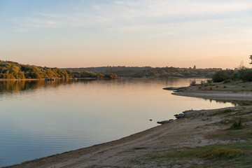 Fototapeta na wymiar Landscape with lake reflection at sunset of Nisa Dam in Alentejo, Portugal