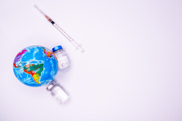Pandemic concept, close up of scientist injecitng vaccine into the earth