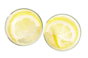Soda water with lemon slices on white background, top view