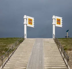 Tuinposter Metal flags in the Dutch tourist village of Zoutelande in Zeeland. © Erik_AJV