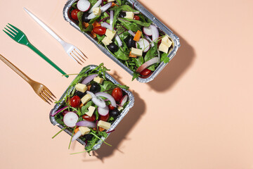 Healthy vegan take away salad in aluminum container