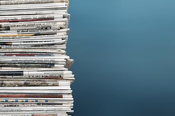 Pile of newspapers on background