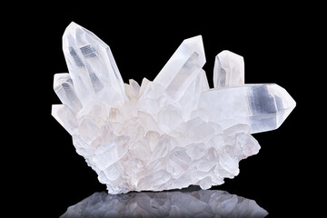 Amazing pure Quartz Crystal cluster gemstone closeup macro isolated on black background. Natural...