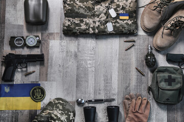 MYKOLAIV, UKRAINE - SEPTEMBER 19, 2020: Ukraine military outfit and equipment on floor, flat lay....