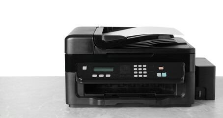 New modern multifunction printer on light grey table
