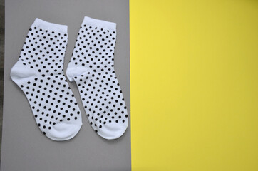 White socks on a gray-yellow background.
