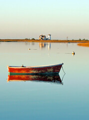 Row boat and Lighthouse at Tranquil Harbor on Cape Cod © Christopher Seufert 