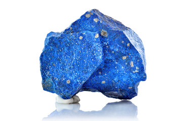 Macro shoot of piece of raw uncut Blue Lapis Lazuli Mineral stone from Afghanistan isolated on white background. Closeup photo of amazing rare Lazurite specimen mineral rough.
