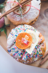Easter Eggs and Cakes on a Wooden Board 