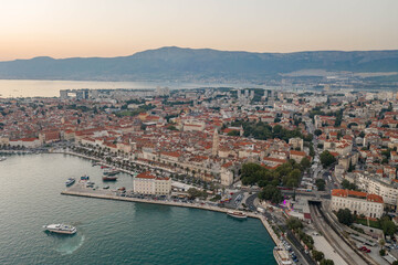 Aerial drone shot of Diocletian Palace by port riva in Split old town in Croatia in sunset