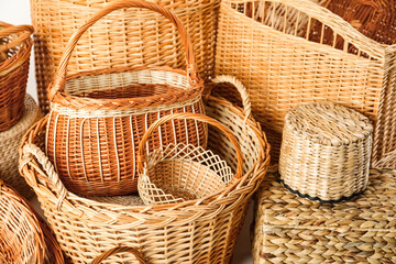 Many different wicker baskets made of natural material as background