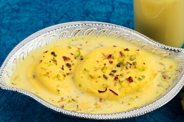 Exotic Mithai Of Bengal Rasmalai Also Known As Rossomalai Rasamalei Ras Malai Roshmolai Made Of Fresh Curdled Milk Pista Meetha Doodh And Kesar. Soaked In Milk Cream And Served In Silver Bowl