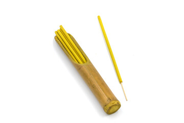 Fototapeta premium Incense sticks with the scent of jasmine. Indonesian incense sticks for relaxation. White background.