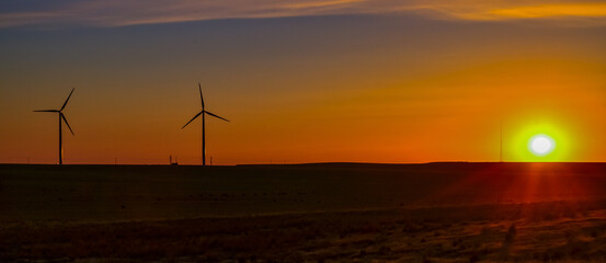 Wind turbines at sunset in the state of Idaho, Scenic view of wind turbines power generator