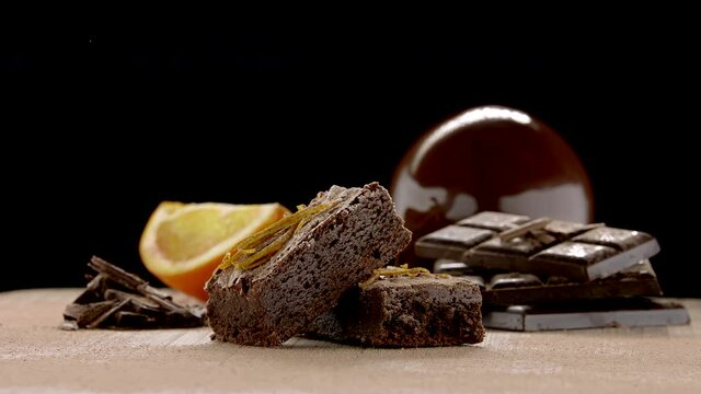 Slowmo Packshot of Brownie Bars with Oranges in the Background 