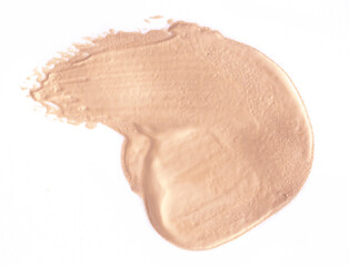 Foundation smear on a white background. A speck of makeup isolated.