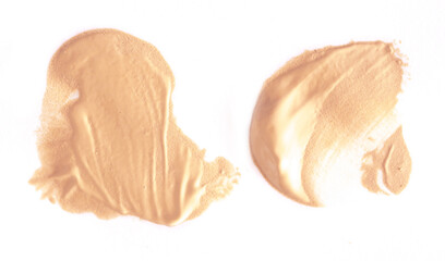 Foundation smear on a white background. A speck of makeup isolated.